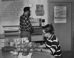 Two men in an office taking orders